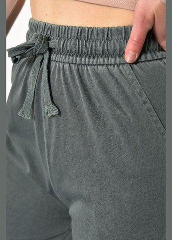 Штаны женские расклешенные полубатальные зеленого цвета Let's Shop (278274537)