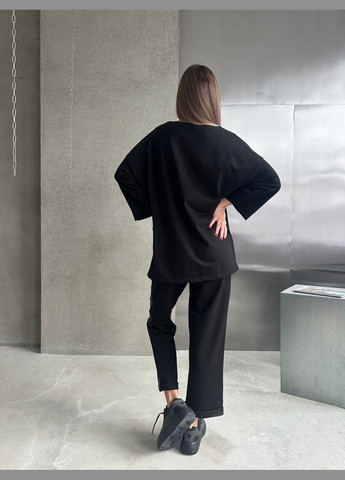 Жіночий костюм двійка колір чорний р.50/52 451788 New Trend (282926674)